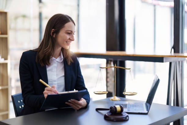 istock Business Lawyer consulting online on laptop while working at office. 1470149827