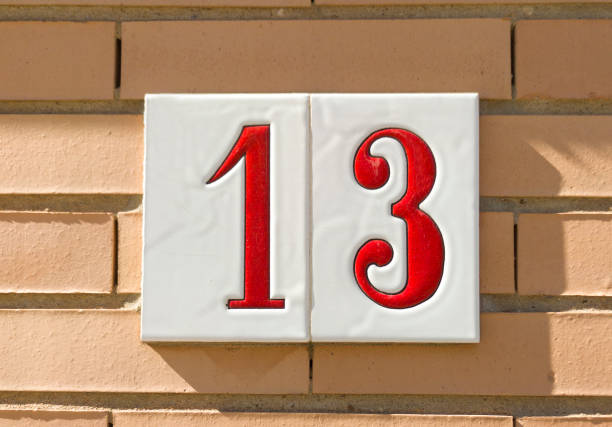 istock House number 13 over brick sunny wall 1470153986
