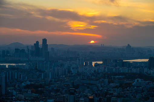 Aerial view of the capital city of Seoul in South Korea, seen at sunset.