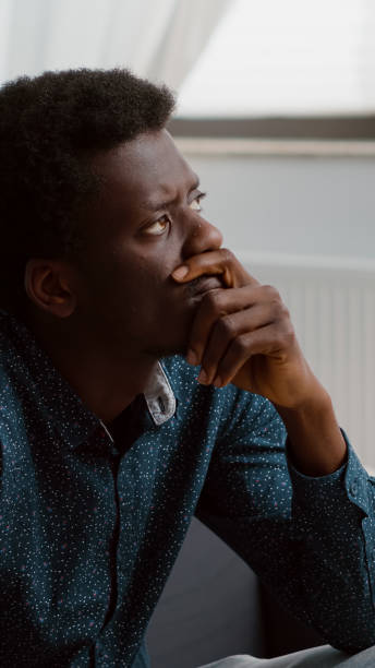 istock Portrait of pensive thoughtful authentic african american man looking out the window 1470154607