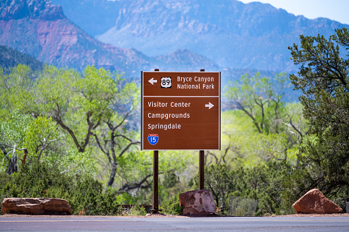 Road information sign at a road crossing in Zion National Park.