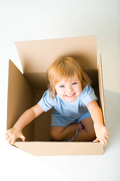 istock Happy young girl in box 147015500
