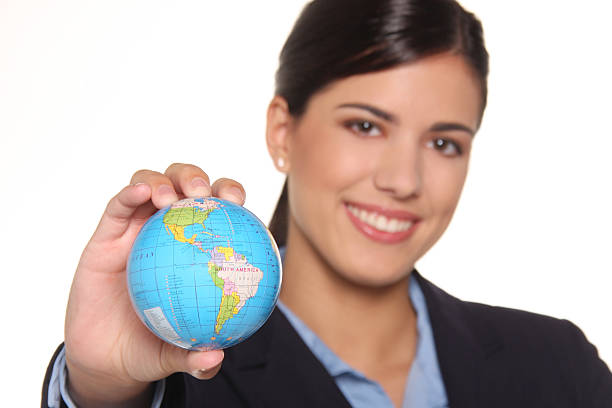istock Attractive business woman holding globe 147015517