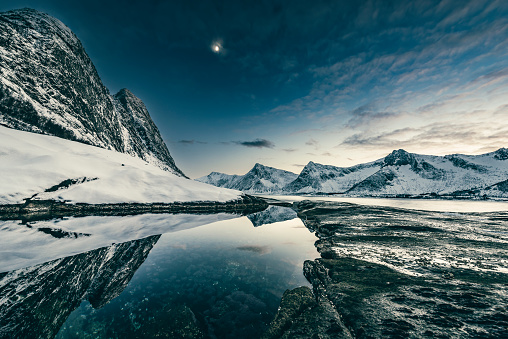 Sunset at Tungeneset in the Steinfjorden at the island of Senja in Northern Norway at the end of a beautiful day in winter.