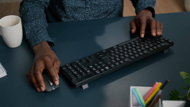 istock Black african american person typing on PC keyboard 1470155227