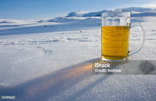 A Jug Of Beer Placed On Top Of The Snow Stock Photo - Download Image Now - Alcohol - Drink, Beauty, Beer - Alcohol