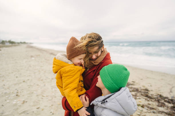 istock Spending windy, winter day at the beach with mom 1470158114