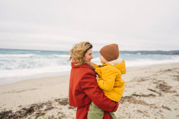 istock Windy day at the beach with mom 1470158118