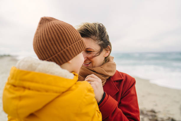 istock Windy day at the beach with mom 1470158125
