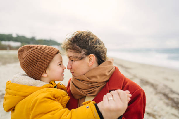 istock Windy day at the beach with mom 1470158127