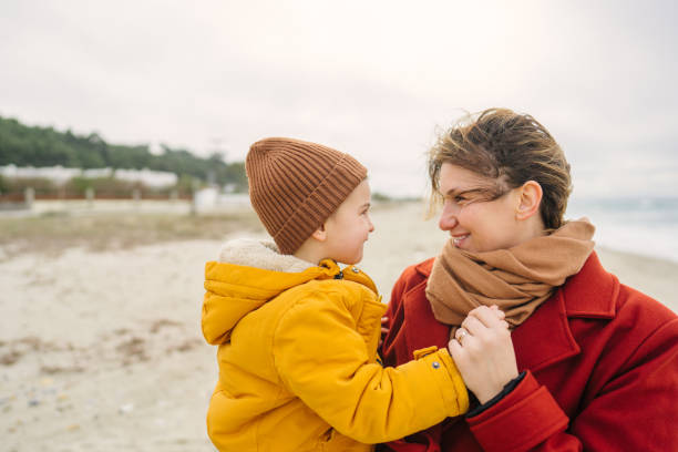 istock Windy day at the beach with mom 1470158131