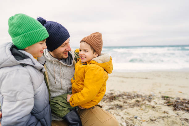 istock Spending windy, winter day at the beach with dad 1470158132