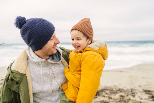 istock Windy day at the beach with dad 1470158146