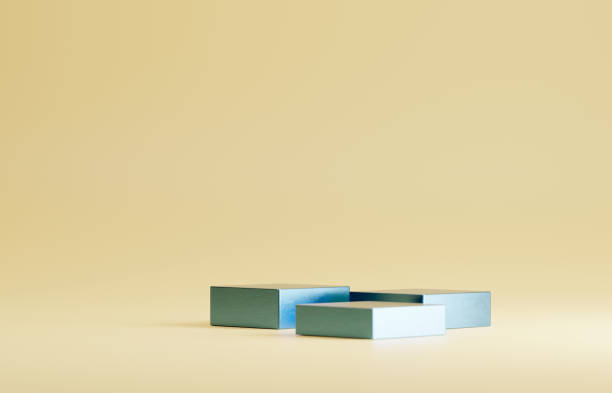 istock Metallic baby blue colored product presentation platforms. On pastel yellow studio floor. 1470160034