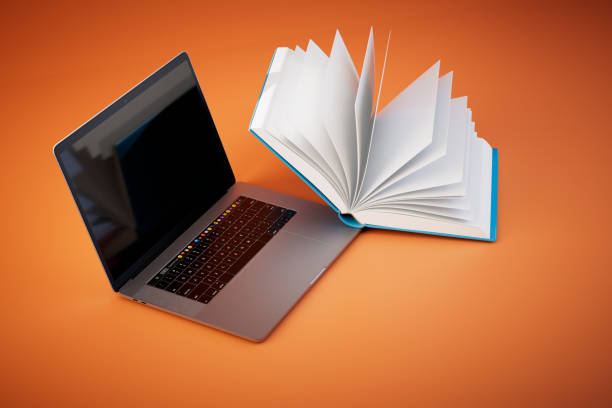 istock the concept of online learning. an open book and a laptop on a orange background. 3D render 1470160165