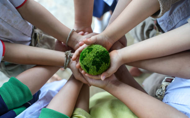 istock Hand holding a globe shaped ball net zero and carbon neutral concept net zero emissions target Long-term, climate-neutral strategy. 1470161365
