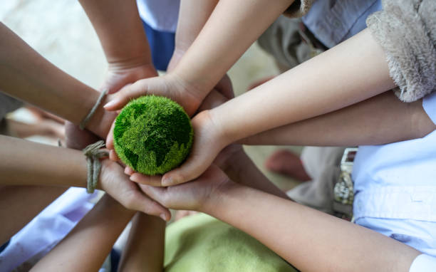 istock Hand holding a globe shaped ball net zero and carbon neutral concept net zero emissions target Long-term, climate-neutral strategy. 1470161375