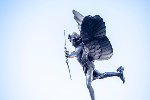 Winged sculpture of Eros on top of the Shaftesbury Memorial Fountain, Piccadilly Circus, London