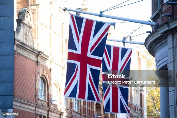 Union Jack Flags Hanging Outside Buildings In London Stock Photo - Download Image Now
