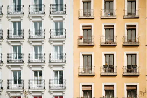 Two different apartment building facades in Madrid, Spain