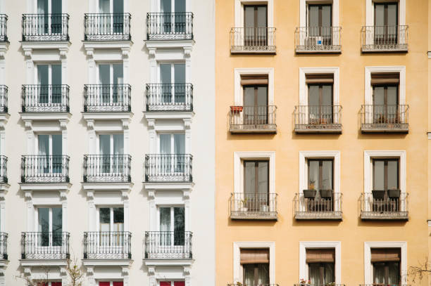 Two different apartment building facades stock photo
