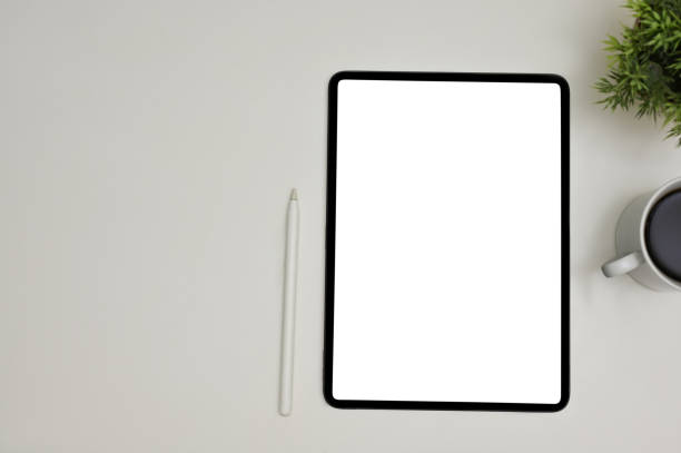 istock Modern workspace top view with a digital tablet white screen mockup on grey background. 1470164180
