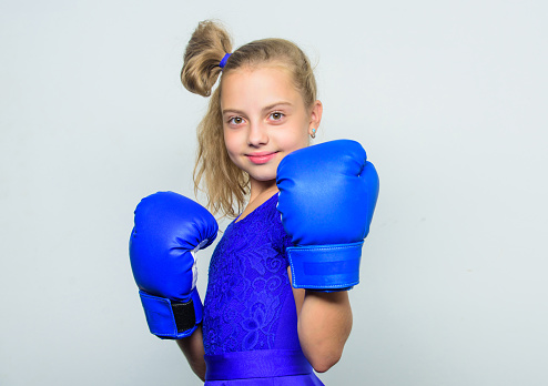 training with coach. Fight. knockout and energy. Sport success. Boxer child workout, healthy fitness. Sport and sportswear fashion. little girl in boxing gloves punching.