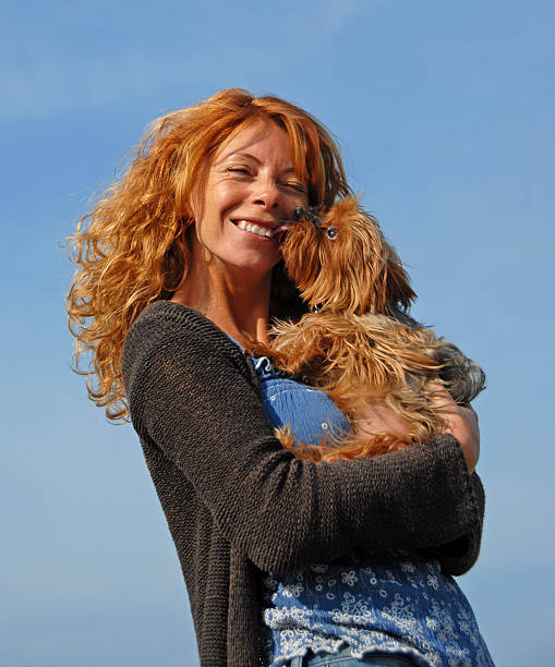 istock woman and little dog 147016582