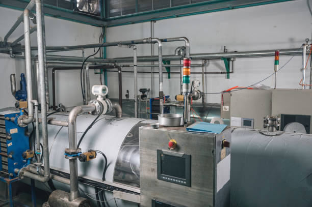 istock Automation processing plant manufacture system with stainless boiler tanks, liquid pipeline and control panel 1470165934