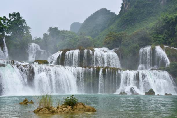 istock Ban Gioc Waterfall with Mist Rising from Splash Pool 1470167719