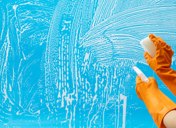 istock Cleaning glass window with sponge and spray bottle 1470170536