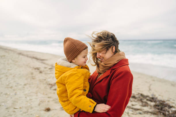 istock Windy day at the beach with mom 1470171888