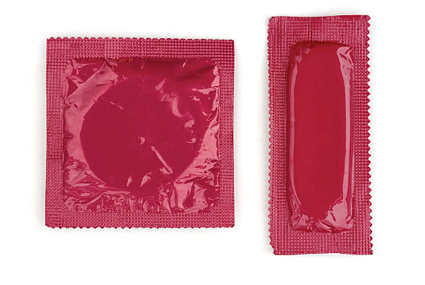 istock Square and Rectangle Pink Condoms on White Background 147017456