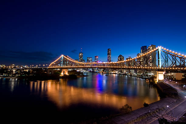 View of Brisbane and Story Bridge at night Brisbane city CBD behind the Story Bridge. story bridge photos stock pictures, royalty-free photos & images