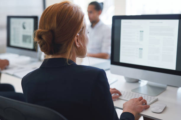 istock Back, business woman and computer for planning, data analysis or internet technology in office. Female worker typing on desktop monitor for seo research, website network or company strategy analytics 1470179842
