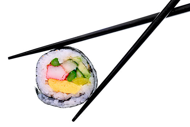 Sushi with black chopsticks isolated on a white background Super clean white background-- professionally isolated with clean edges and no grey.  Carefully spotted and retouched. japanese food photos stock pictures, royalty-free photos & images