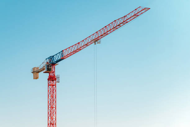 istock Construction crane in front of cloudless sunny blue sky 1470181496