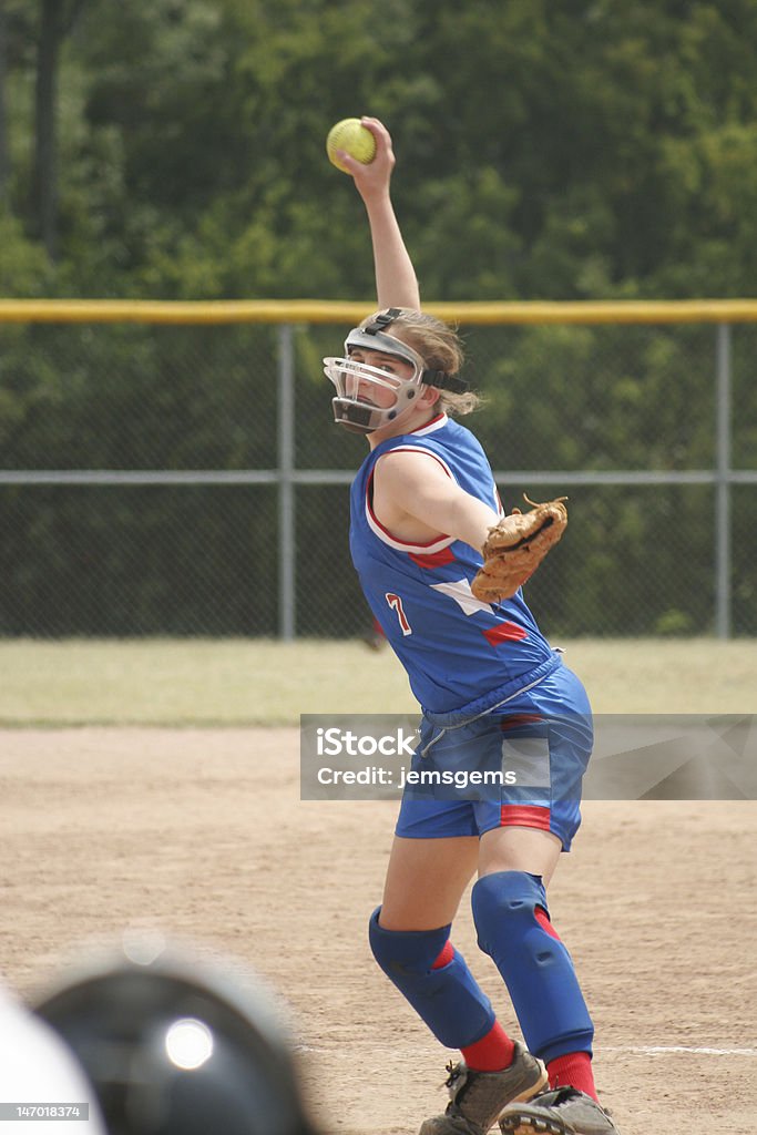 Pitch! A front on view of a fast pitch windup. Softball - Sport Stock Photo