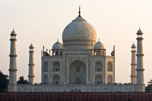 A photo of the Taj Mahal in Agra, India from across the river at sunset.