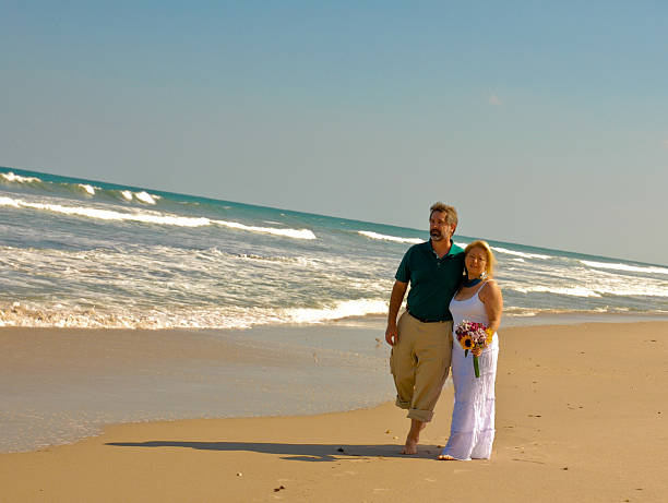 Couple on beach stock photo