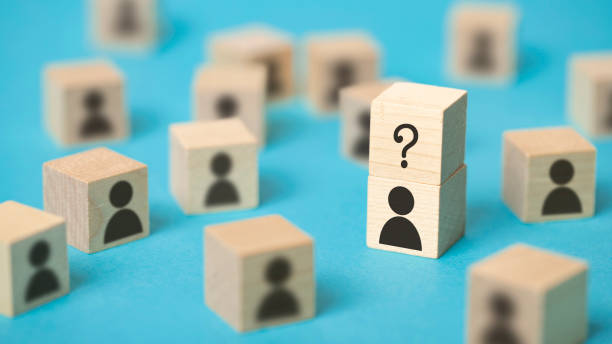 istock Single person having a question surrounded by a group of people 1470190511