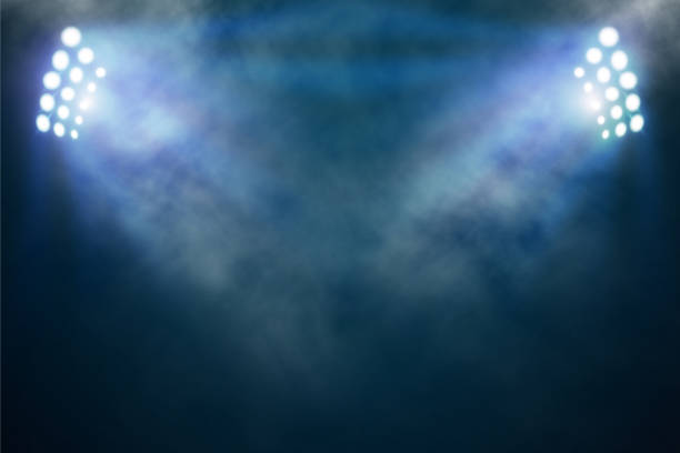 helle stadionarena-lichter und rauch - flutlicht stock-fotos und bilder