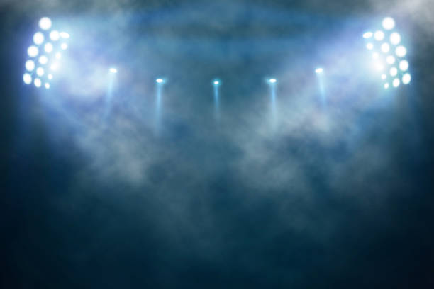 istock Bright stadium arena lights and smoke 1470190557