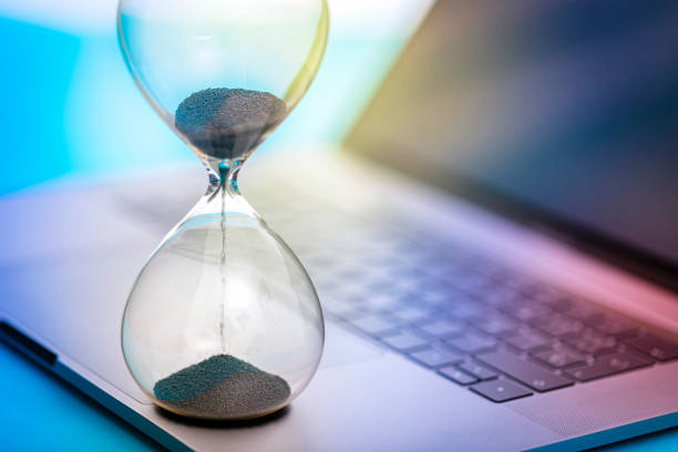 istock Time management concept: Hourglass on laptop 1470191064