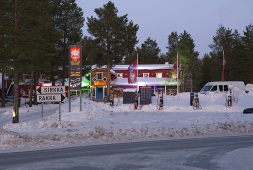 Sirkka, Finland - February 13, 2023: Hullu Poro Hotel Crazy Rendeer and Ravintola Wanha at Levi Center near Kittila in a clear winter afternoon with snow. Waiting for Northern Lights. Selective focus