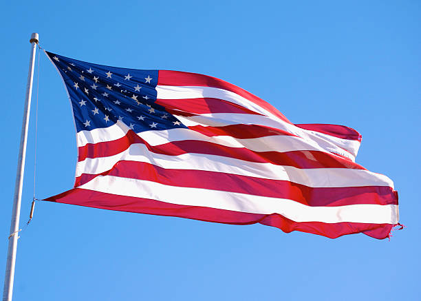 istock USA Flag Waving Over Texas Skies 147019742
