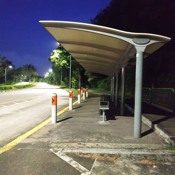 empty bus stop shed along a deserted road