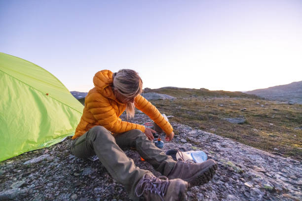 istock Woman using kitchen camp outdoors 1470198645