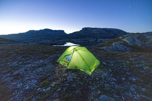 Tent at night in the Trolltinden mountain range, Norway