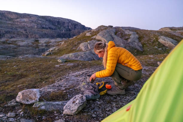 istock Woman using kitchen camp outdoors 1470202378
